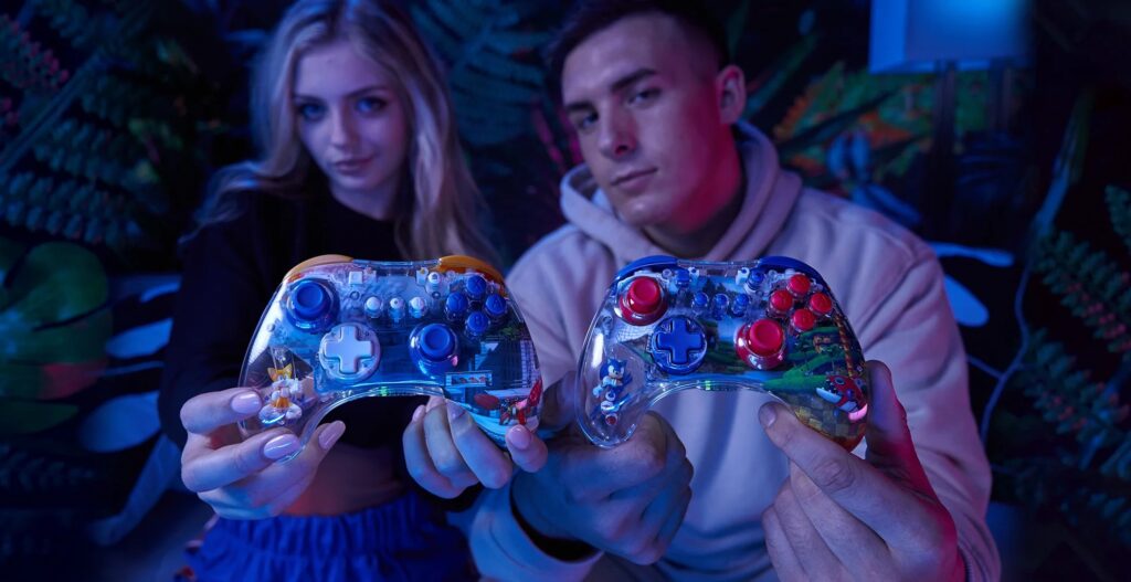 Woman and male showing off REALMZ Controllers