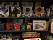 Multiple GameCube consoles and other special Nintendo objects next to each other